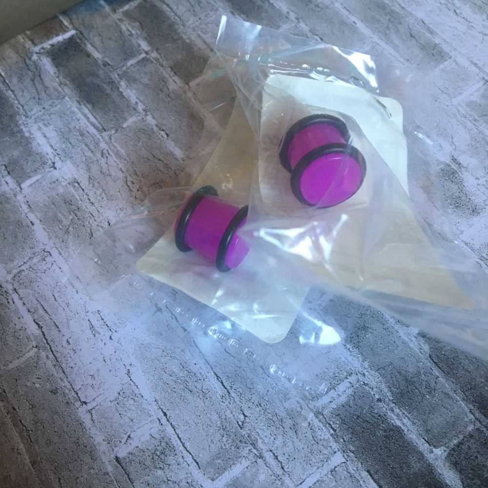 3/$12‼️Pair of neon purple plugs